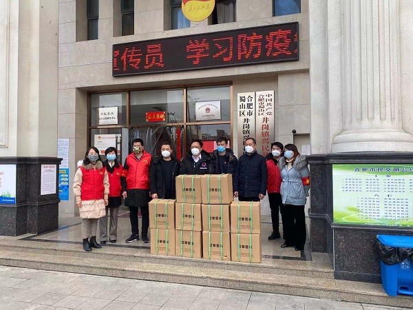 图六：党建共同体成员单位安徽省粮食集团有限责任公司党委捐赠大米.JPG